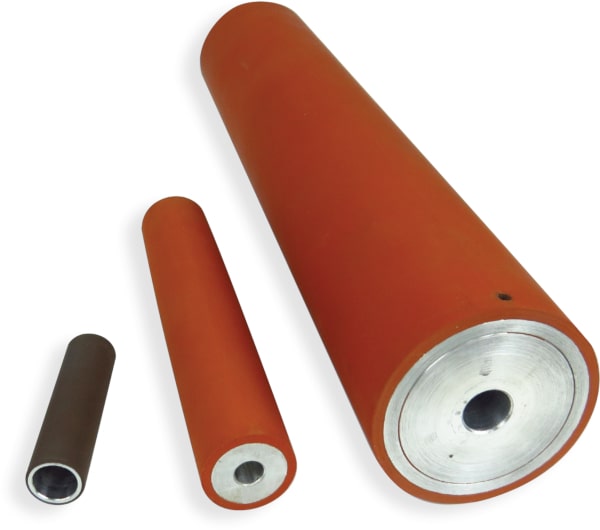 Precision rollers made of high temperature silicone rubber bonded to metal cores.