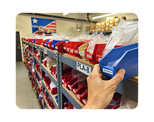 ISM orders being picked from a blue bin from our warehouse ISM orders being picked from a blue bin from our warehouse